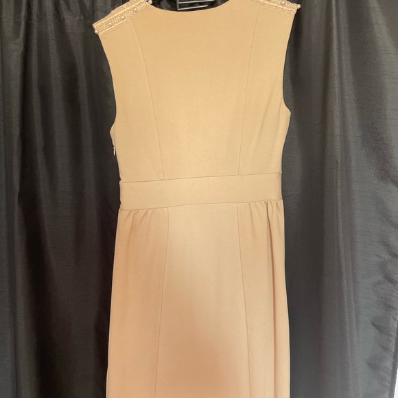Never worn classy neutral dress with pearl detaining. Size small fits like a 6. - Picture 2 of 3